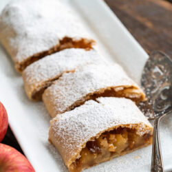Apple Strudel on a white rectangular serving plate.