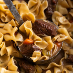 This hearty Beef Noodle Soup Recipe is packed with veggies, noodles, and lots of protein to fill you up on a cold day.