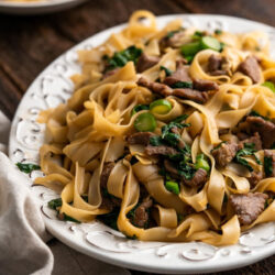 A white plate with Beef pad see ew.