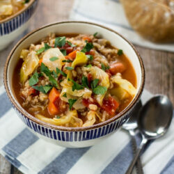 Cabbage Roll Soup in a bowl, topped with fresh parsley.