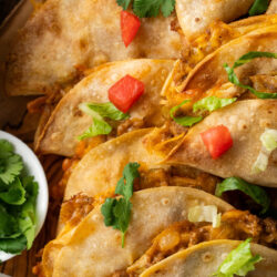 Immerse yourself into these homemade Crispy Beef Tacos. Juicy ground beef wrapped inside a tortilla and baked until crisp.