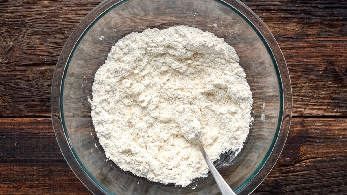 Flour added to the mixing bowl.
