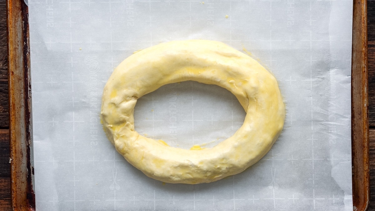 Forming a smooth oval shape from the dough.
