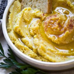 Greek Fava in a bowl served with bread.