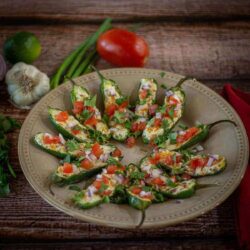 Grilled Stuffed Jalapenos on a plate.