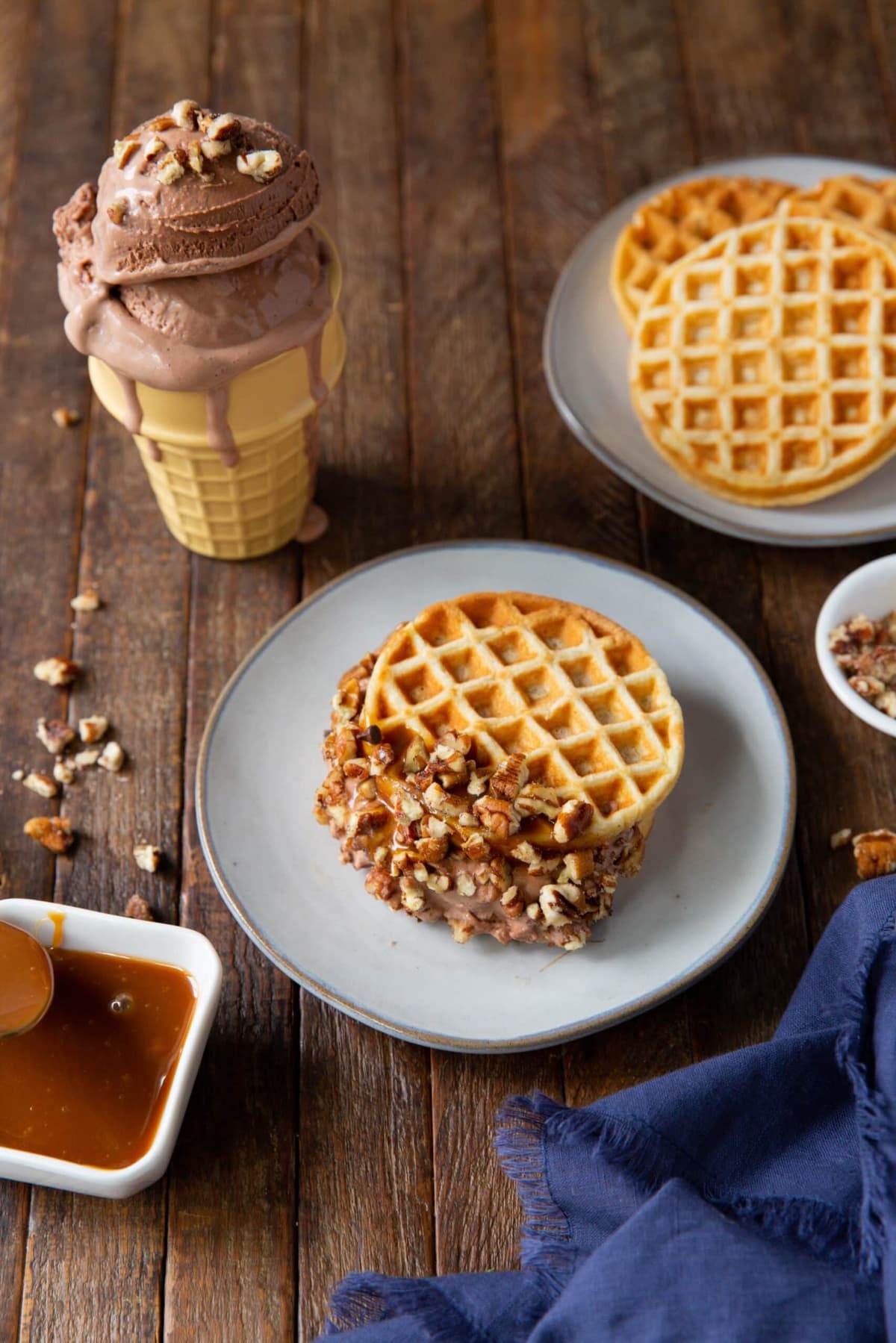 Turtle candy with chocolate ice cream, dipped in creamy caramel sauce, and topped with pecans.