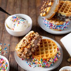 Homemade waffle ice cream sandwiches on a plate.