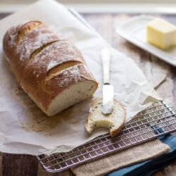 Honey herb bread on a wire rack.