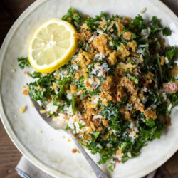 Top-down view of a plate of massaged kale and wild rice salad.