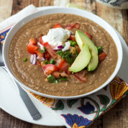 A bowl filled with Mexican pinto bean soup.
