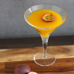 Indulge in this fun and fruity Passion Fruit Martini recipe. A tropical and refreshing cocktail that is delicious year round!