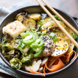 A bowl of Ramen Noodle Bowls with crispy Brussels sprouts.