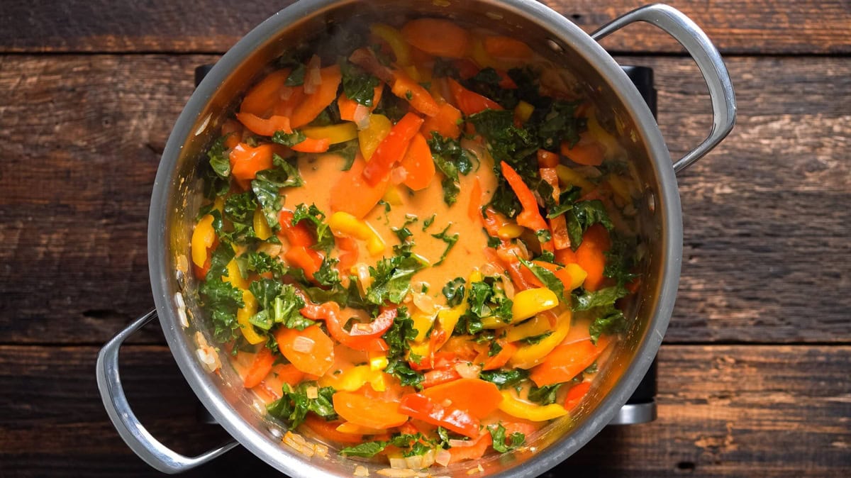 Cooking the vegetables until softened.