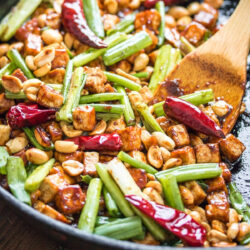 Kung Pao Tofu cooking in a skillet.